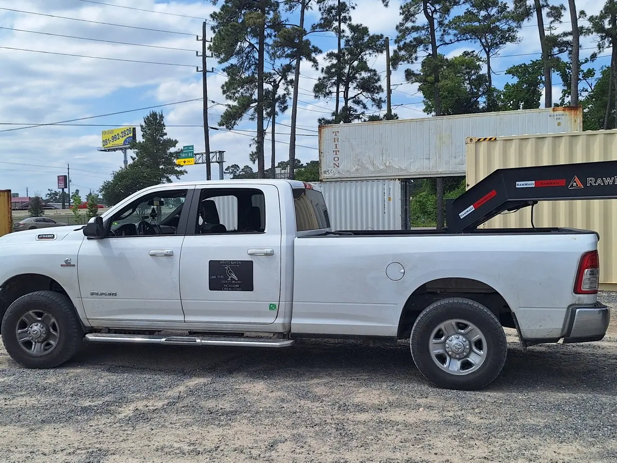 White Raven company door logo on the Ram pickup