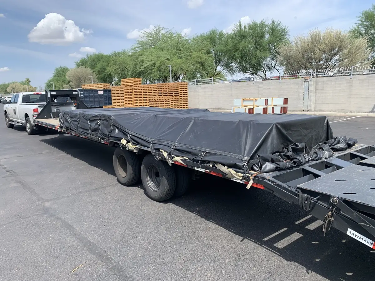 Load tarped and strapped on the trailer